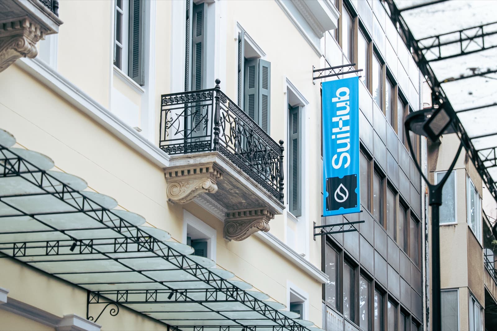 Look for the blue SuiHub banner on the building.